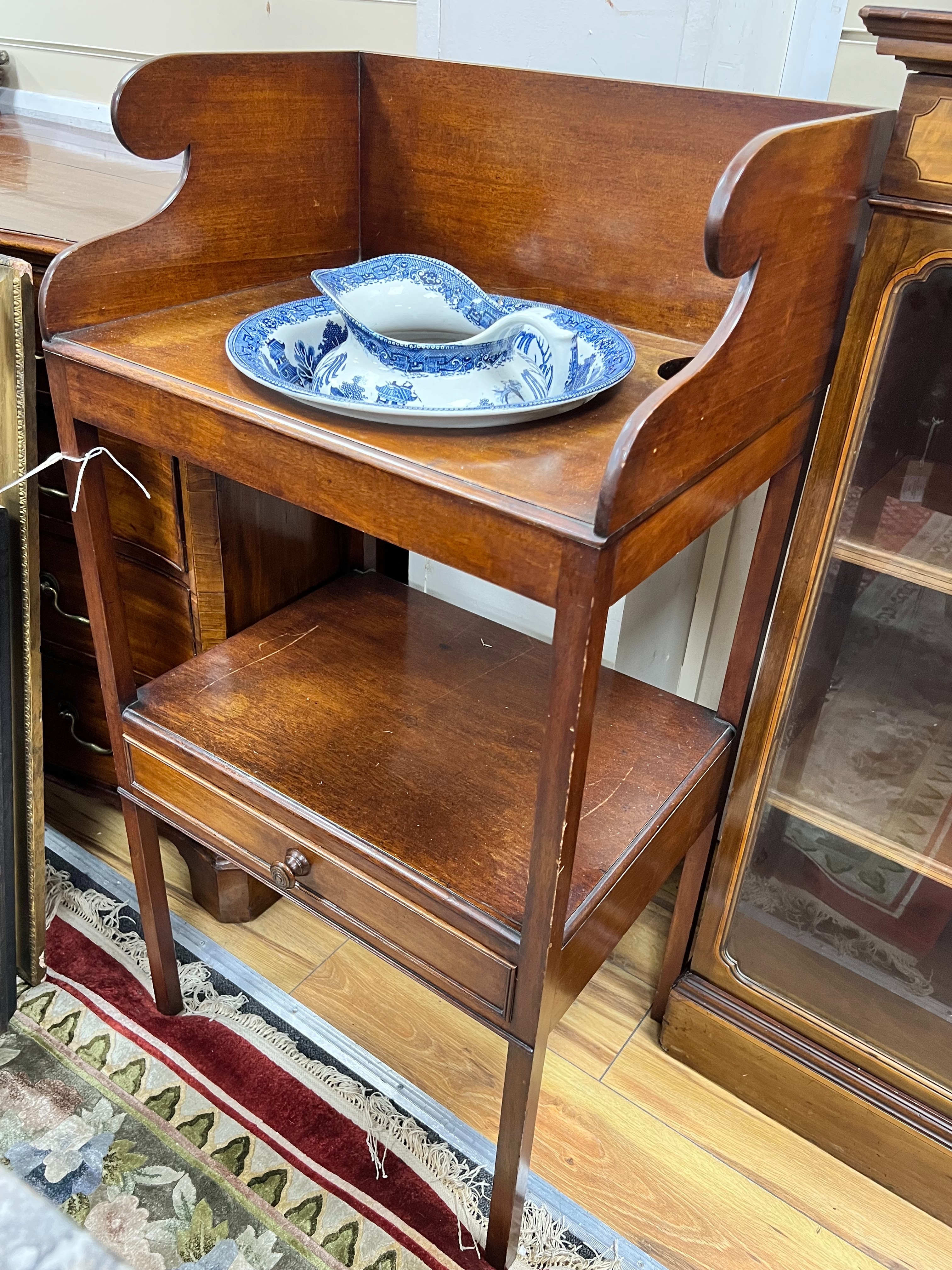 A Regency mahogany two tier washstand, together with a Staffordshire blue and white jug and basin, width 50cm depth 38cm height 101cm